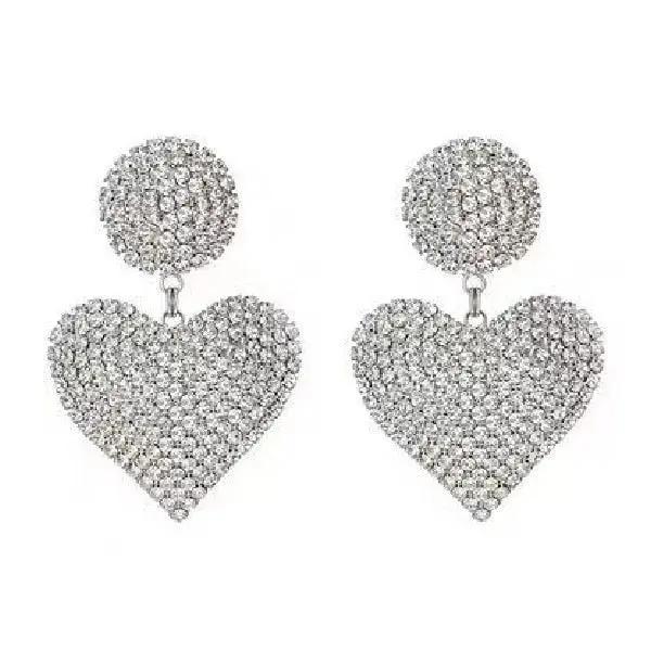 Crystal heart drop earrings worn, silver-tone statement piece | Hair Your Lux