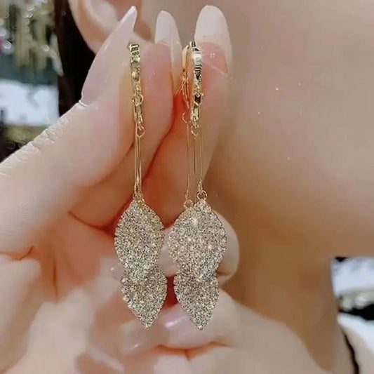 Crystal pavé leaf drop earrings on gold huggie hoop | Hair Your Lux
