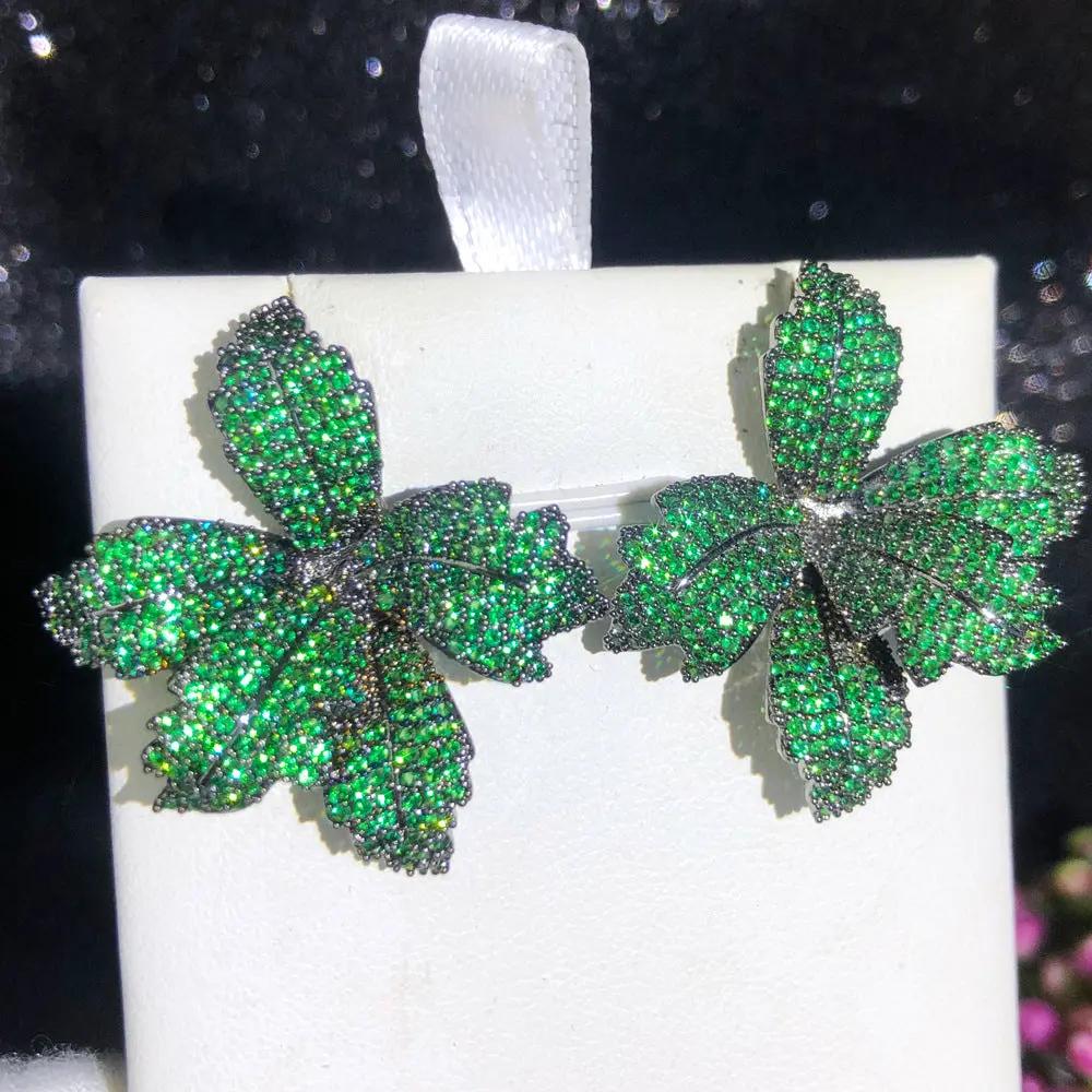 Pavé crystal leaf earrings on ear | Hair Your Lux