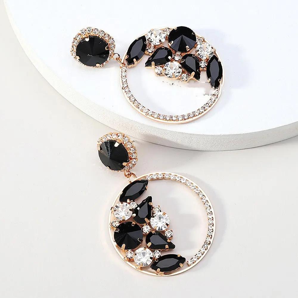 Statement crystal circle drop earrings on ear | Hair Your Lux