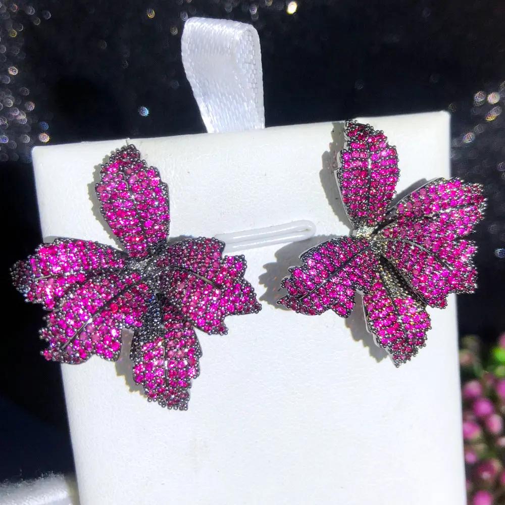 Leaf-shaped crystal stud earrings detail | Hair Your Lux