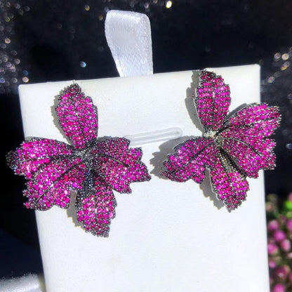 Leaf-shaped crystal stud earrings detail | Hair Your Lux