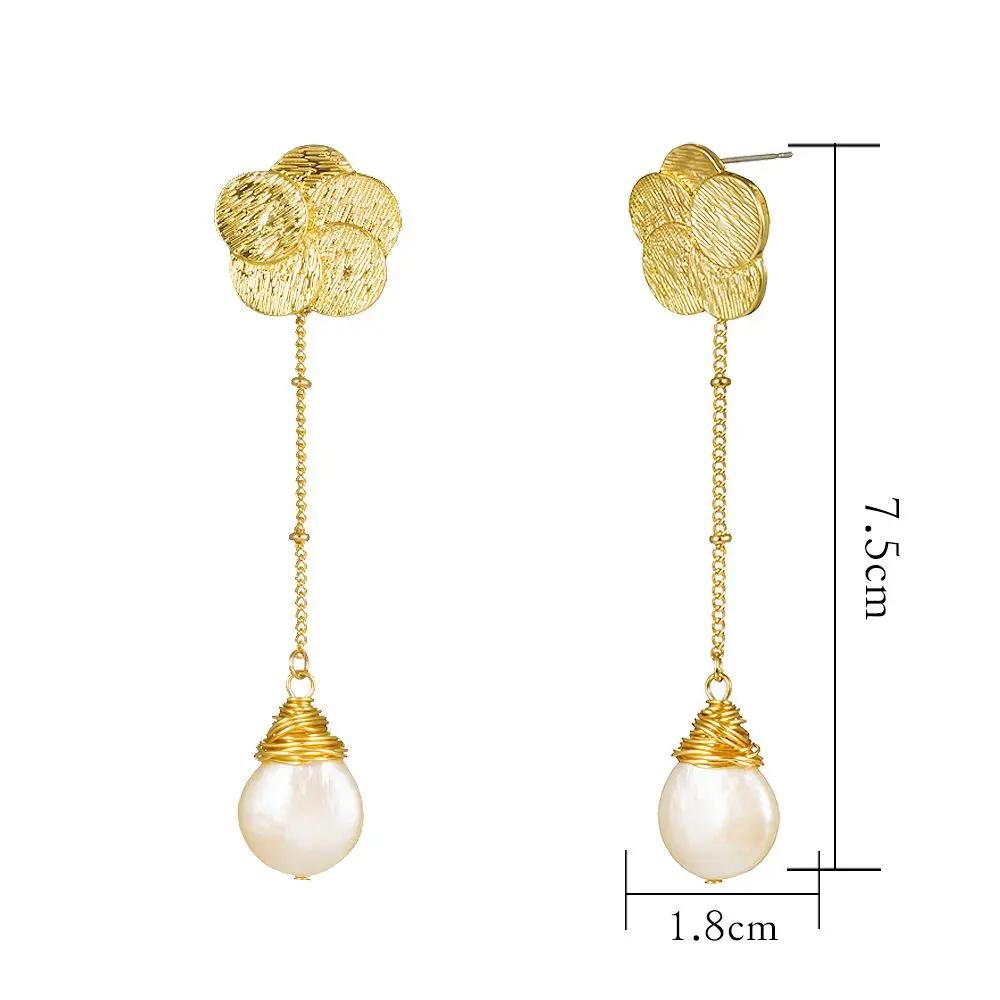 Long gold flower and freshwater pearl drop earrings | Hair Your Lux