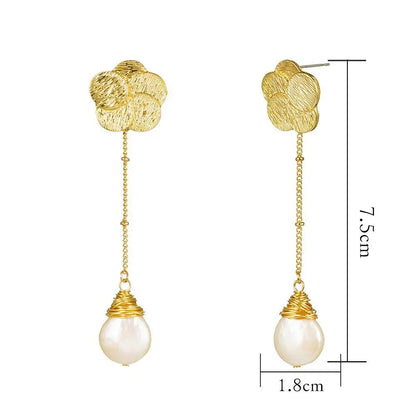 Long gold flower and freshwater pearl drop earrings | Hair Your Lux