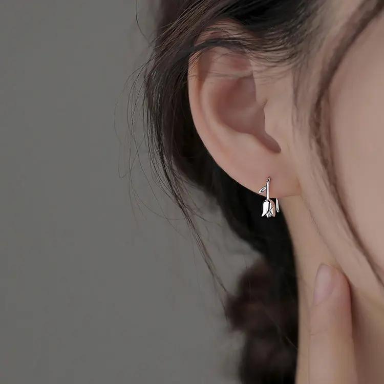 Delicate silver-tone tulip stud earrings detail | Hair Your Lux