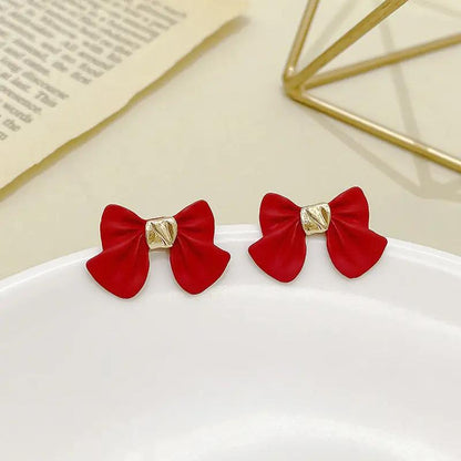 Bow stud earrings, matte black with gold knot | Hair Your Lux