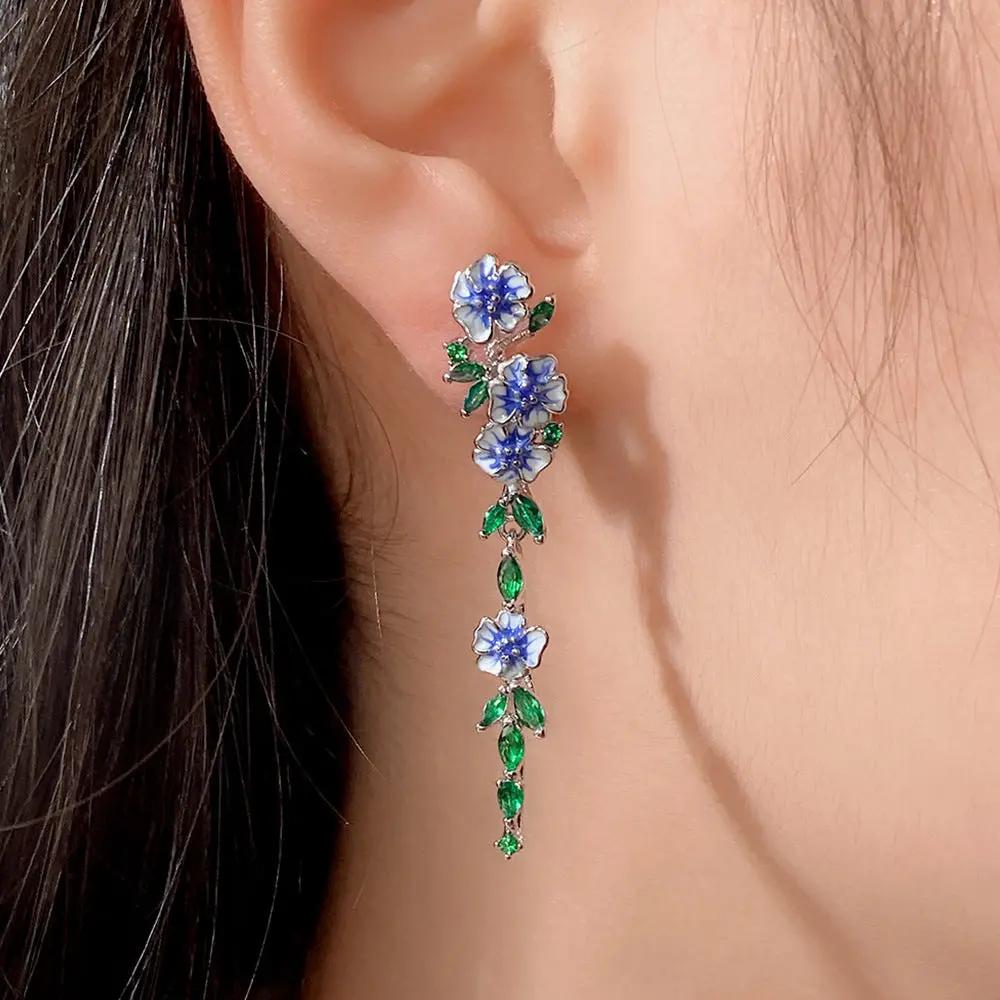 Enamel blue flower chain earrings with green zircon leaves | Hair Your Lux
