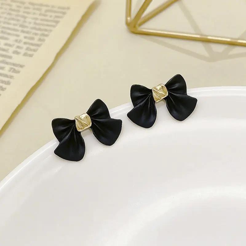 Matte bow stud earrings with gold centre accent, black | Hair Your Lux