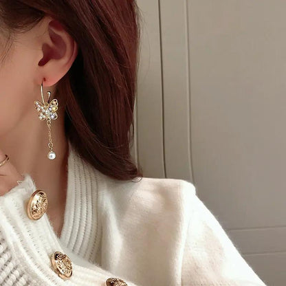 Crystal butterfly tassel drop earrings worn, gold-tone with pearl drops | Hair Your Lux