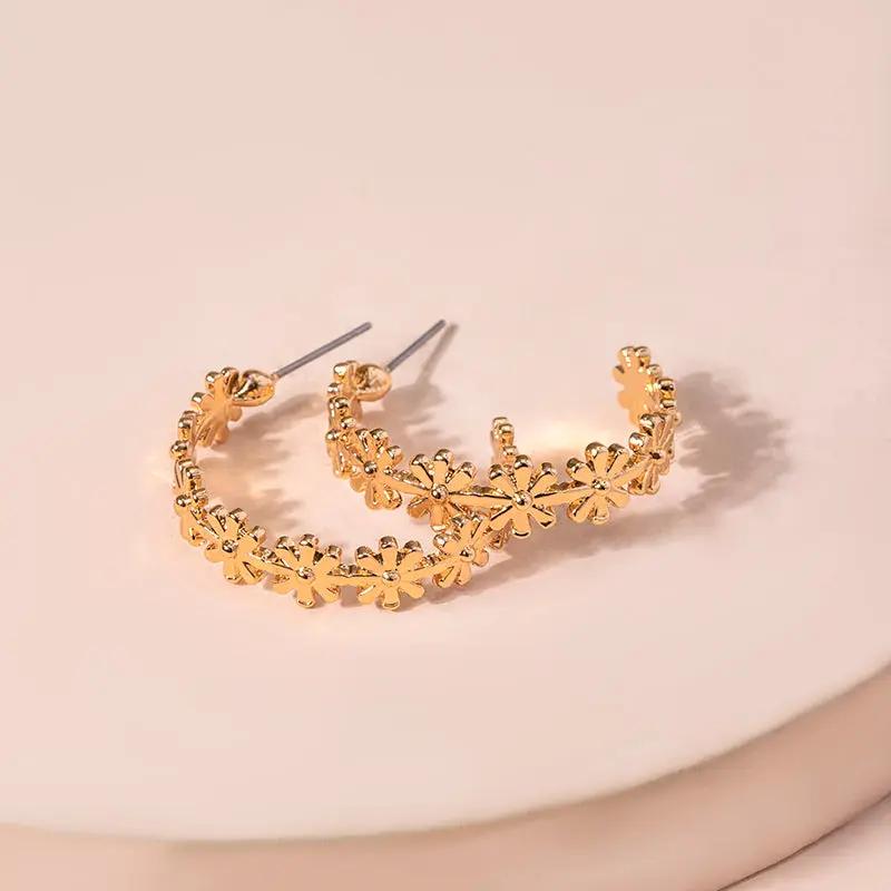 Gold-tone hoop lined with tiny daisy flowers | Hair Your Lux