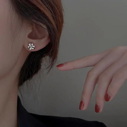 Intertwined ribbon love-knot studs, silver-tone | Hair Your Lux