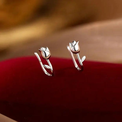 Silver tulip flower stem earrings on ear | Hair Your Lux